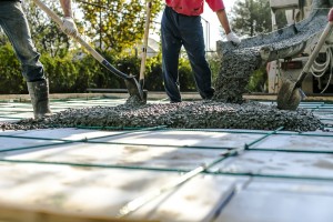 Team of concrete workers lay concrete slab in East Texas